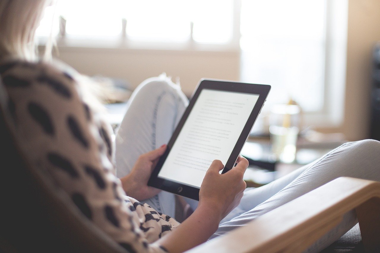 woman reading an e-book